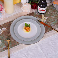 Jinying Ensemble de vaisselle en céramique de luxe Plats 4 pièces Ensemble de table à dîner ronde Assiette de présentation Vaisselle à rebord vert or pour événement