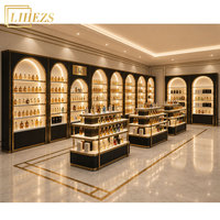Étagères de présentation de parfums sur mesure, élégantes, de haute qualité, noires et dorées, en forme d'arche, solution complète pour les magasins de parfums, avec design inspiré de Dubaï