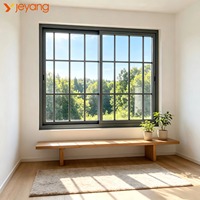 Fenêtre coulissante antivol en aluminium avec grille en alliage d'aluminium pour villa, vue sur jardin