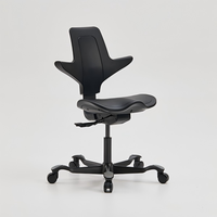 Protecteur orthopédique de colonne vertébrale de selle Chaise d'équitation ergonomique Tabouret de selle d'équitation de dentiste Chaise pivotante roulante Chaises moussantes en PU