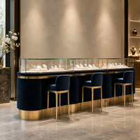 Comptoir de présentation de bijoux noir sur mesure avec dessus en verre, bordure dorée et tiroirs pour la vente en gros aux bijouteries