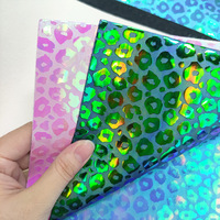 Cuir PU léopard laser gaufré effet miroir, épaisseur 0,7 mm, résistant à l'abrasion, avec fond en laine, couleur magique, vente en gros usine