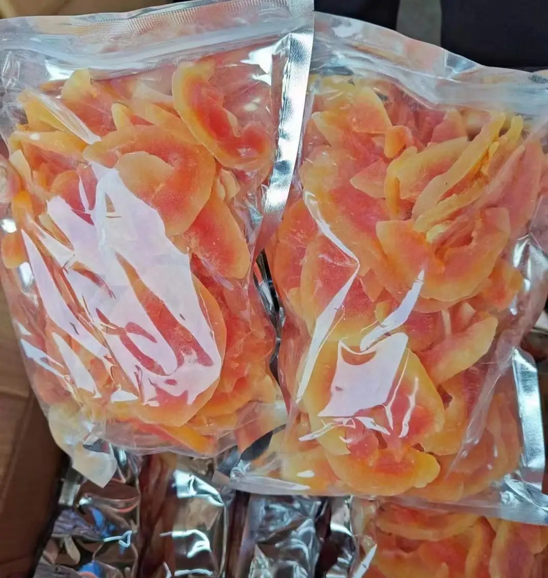 शीर्ष गुणवत्ता वाले चीनी सूखे पपीता फल के टुकड़े मीठी चीनी सूखे कटे हुए पपीता स्नैक्स आपूर्तिकर्ता