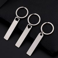 Usine personnalisée en acier inoxydable forme de bande blanc porte-clés pendentif gravé au laser Logo laiton métal porte-clés
