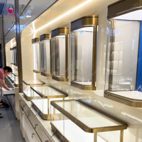 Vitrine de luxe Sundo pour bijoux, présentoir bleu rétroéclairé, niche murale dorée, fabricant d'agencements de magasin