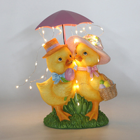 Canards de Pâques fantaisistes en résine avec parapluie, lumières LED et panier d'œufs de Pâques, décoration moderne transparente dorée pour patio et jardin B2B