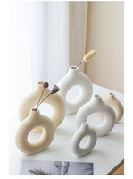 Vase donut de luxe fait à la main Nouveaux designs Vase à fleurs en céramique décoratif nordique pour la décoration intérieure et le mariage pour l'affichage de bureau