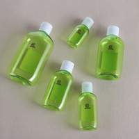 Flacon cosmétique transparent vert en PET de 30 à 300 ml avec bouchon à clapet blanc pour emballage de shampoing et revitalisant – Vente en gros