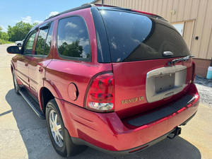 Véhicule d'occasion pas cher Rainier AWD CXL Plus SUV 4 portes 2004 avec régulateur de température, radio, On-Star, sièges en cuir gauche, phares à LED - Product Image 4
