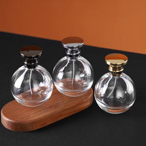 Flacon pulvérisateur de parfum en verre rond transparent haut de gamme de 100 ml, rechargeable, avec bouchon en alliage de zinc doré ou argenté - Product Image 2