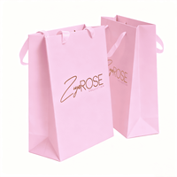 Sacs cadeaux en papier rose pâle en gros avec logo imprimé à chaud en or, sacs de shopping de luxe personnalisés pour boutiques de cosmétiques et de vêtements