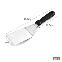 Tourne-steak / Spatule résistant à la chaleur avec manche noir