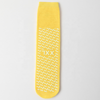 Chaussettes antidérapantes de couleur de taille de matériau personnalisée pour l'ensemble jaune de chaussettes antidérapantes de centre de soins de santé d'hôpital
