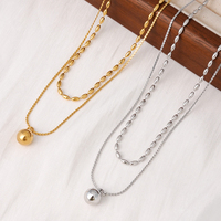 Collier Pendentif Double Couche en Acier Inoxydable Doré CLIORO avec Perles Ovales et Billes – Bijou Tendance pour Femme, Accessoire Quotidien et de Fête