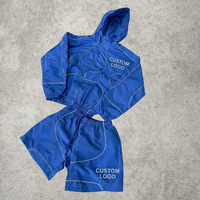 Ensemble de survêtement 2 pièces en nylon avec logo personnalisé OEM pour homme, style streetwear Y2K, avec bandes réfléchissantes, veste coupe-vent zippée et short