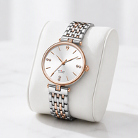 Montre à quartz pour femme, personnalisée, de luxe, décontractée, moderne, bicolore, avec aiguilles en verre, diamants et aiguilles dorées, en acier inoxydable