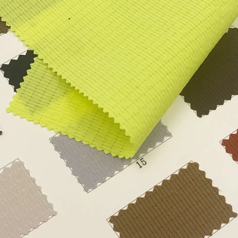 Tessuti giallo brillante colori fluorescenti hollow plaid texture respira liberamente 90 poliestere 10 tessuti in nylon per abbigliamento sportivo