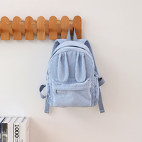 Sac à dos en velours côtelé personnalisé en gros avec oreilles de lapin, poche avant zippée, poches latérales à cordon de serrage, bretelles réglables