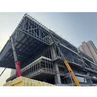 Structure en acier préfabriquée à faible coût et longue durée de vie, bâtiment métallique standard GB, entrepôt, atelier avec mur en panneau sandwich
