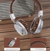 AKZ-606 Nouveau modèle exclusif transfrontalier d'écouteurs sans fil circum-auriculaires Bluetooth 5.4, pliables, avec fente pour carte et serre-tête à motifs
