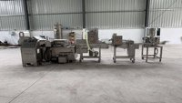 Ligne de traitement industrielle des nuggets, équipement de formage, d'enrobage, de panification et de friture pour la production de snacks surgelés