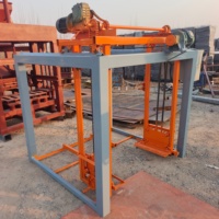 Machine automatique de superposition de palettes pour ligne de production de blocs de béton