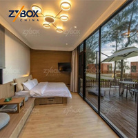 ZYBOX Conteneurs préfabriqués extensibles durables en métal noir de 20 et 40 pieds avec salle de bain et cuisine compacte pour maisons et complexes hôteliers