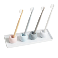 Support de brosse à dents en céramique miniature nordique en gros, forme ronde, en ensembles de salle de bain colorés