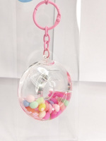 Fabricant OEM ODM, Vente en gros : Porte-clés mini donut créatif et original, avec paillettes, sequins et flotteur aquatique à sable mouvant, idéal comme souvenir, cadeau ou jouet
