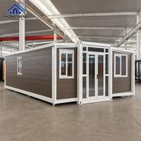 Entrée centrale en verre avec fenêtres supérieures et latérales pour projets résidentiels modernes, maison conteneur extensible