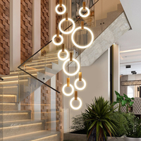 Lustre suspendu moderne créatif pour escalier et salon, design long et rotatif, style duplex