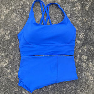 ชุดออกกำลังกายสีพื้น เสื้อชั้นในกีฬาแบบไขว้หลัง กางเกงเลกกิ้งเอวสูงขาสั้น ชุดโยคะ ชุดกีฬา 2 ชิ้น สำหรับผู้หญิง - Product Image 2