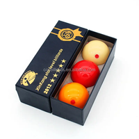 Prix direct usine Xinkang 5 étoiles 61,5 mm Boule de billard carom 3 pièces par boîte Utilisation en tournoi Résine phénolique