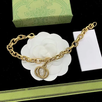 Vente en gros de bijoux de marque célèbre, collier, bracelet et boucles d'oreilles avec breloque lettre GG plaqué or