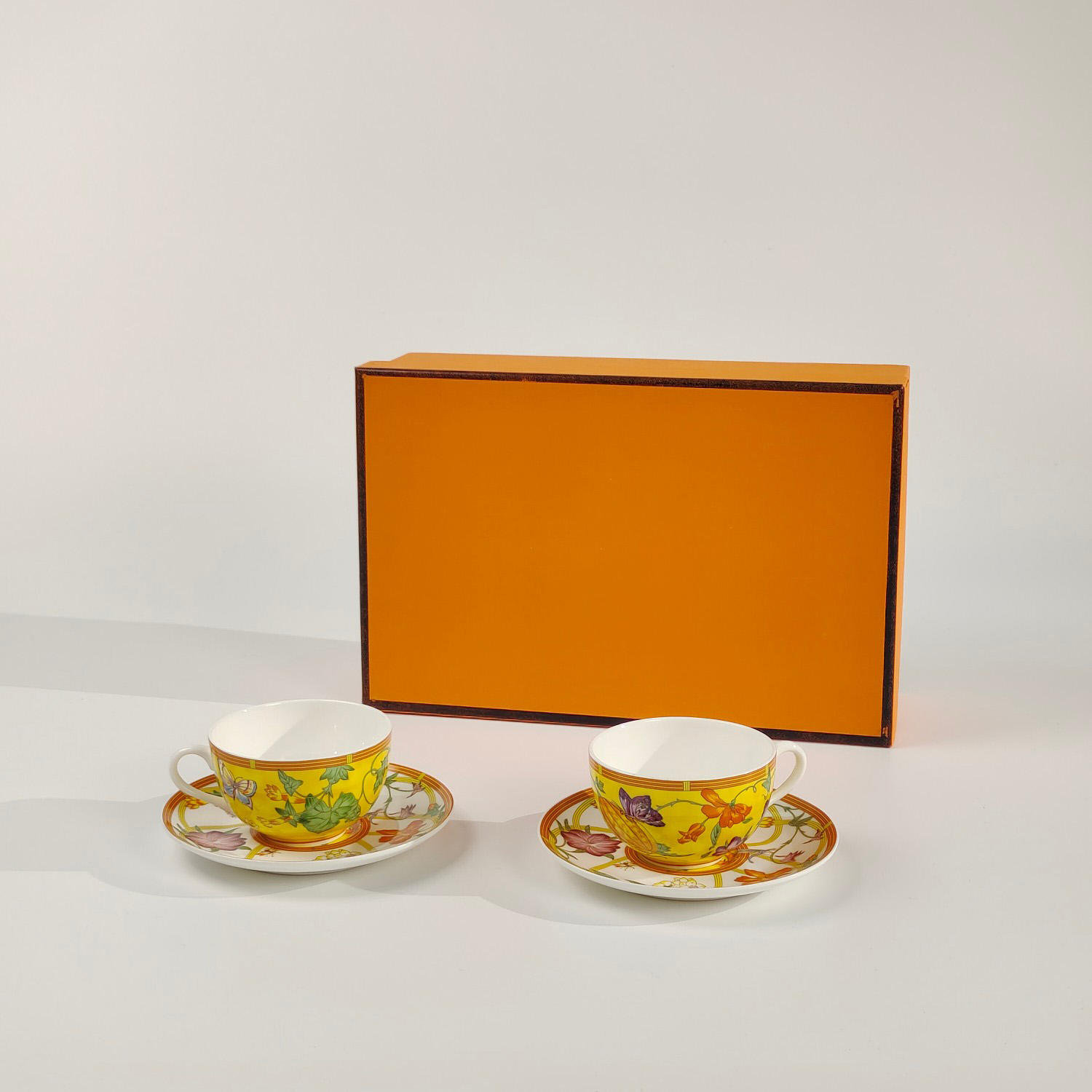 Yellow double cup and saucer