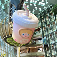 Grande mascotte gonflable personnalisée avec logo couleur en forme de bouteille ou de tasse à café pour campagne marketing d'ouverture de boutique