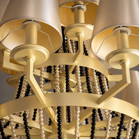Lustre de luxe de style américain moderne en acier inoxydable doré et cristal K9 avec base d'ampoule E12 pour la décoration d'hôtels et de villas