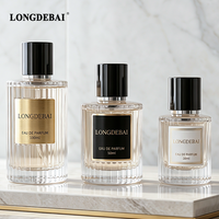 Flacon de parfum en verre transparent rond portable d'usine, vide, 30ML 50ML 100ML, rechargeable, avec bouchon magnétique et pulvérisateur à vis