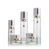 Bouteille de pompe de lotion en verre transparent vide de 40ml 100ml 120ml avec couvercle blanc pour stocker les soins de la peau