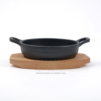 Vente de gros Plat à gratin rond en fonte Assiette Fajita avec socle en bois