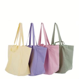 กระเป๋าผ้าแคนวาสสีพื้นเรียบง่ายขนาดใหญ่พิมพ์โลโก้ตามสั่งขายส่ง พร้อมหูหิ้วคู่และช่องใส่ของ - Product Image 2