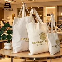 Sac de shopping en non-tissé noir à grande capacité avec poignées robustes et logo personnalisé pour les boutiques