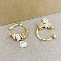 Nouvelles boucles d'oreilles élégantes et tendance, design de niche de luxe léger, pendentif cube en forme de cœur orné de strass, émail glacé