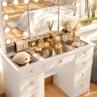 Vente en gros de bureau de maquillage en MDF blanc avec miroir triple éclairé, plateau en verre et 9 tiroirs