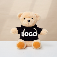 Ours en peluche avec logo personnalisé de l'usine de jouets en peluche professionnels 22cm Animal en peluche doux en chemise blanche et noire à capuche pour les anniversaires