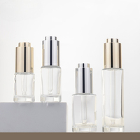 Flacon compte-gouttes en verre de haute qualité vide de 10 ml, 15 ml, 20 ml, 30 ml pour sérum, essence ou huile de soin de la peau avec bouton poussoir doré ou argenté