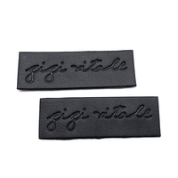 Écusson en cuir noir personnalisé avec logo de marque en relief pour jeans