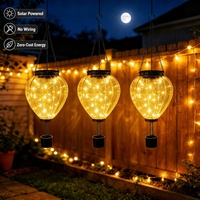 Lanterne solaire décorative en forme de montgolfière, avec cadre en fer et acrylique ambré, pour jardin, terrasse et extérieur nocturne