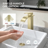 Robinet de lavabo sur pied en acier inoxydable doré poli avec cartouche céramique et bonde escamotable pour salles de bain d'hôtels et d'appartements