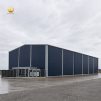 Entrepôt préfabriqué en structure métallique industrielle, charpente à portique rigide, bâtiment d'atelier métallique résistant aux intempéries, prêt pour l'énergie solaire, stockage